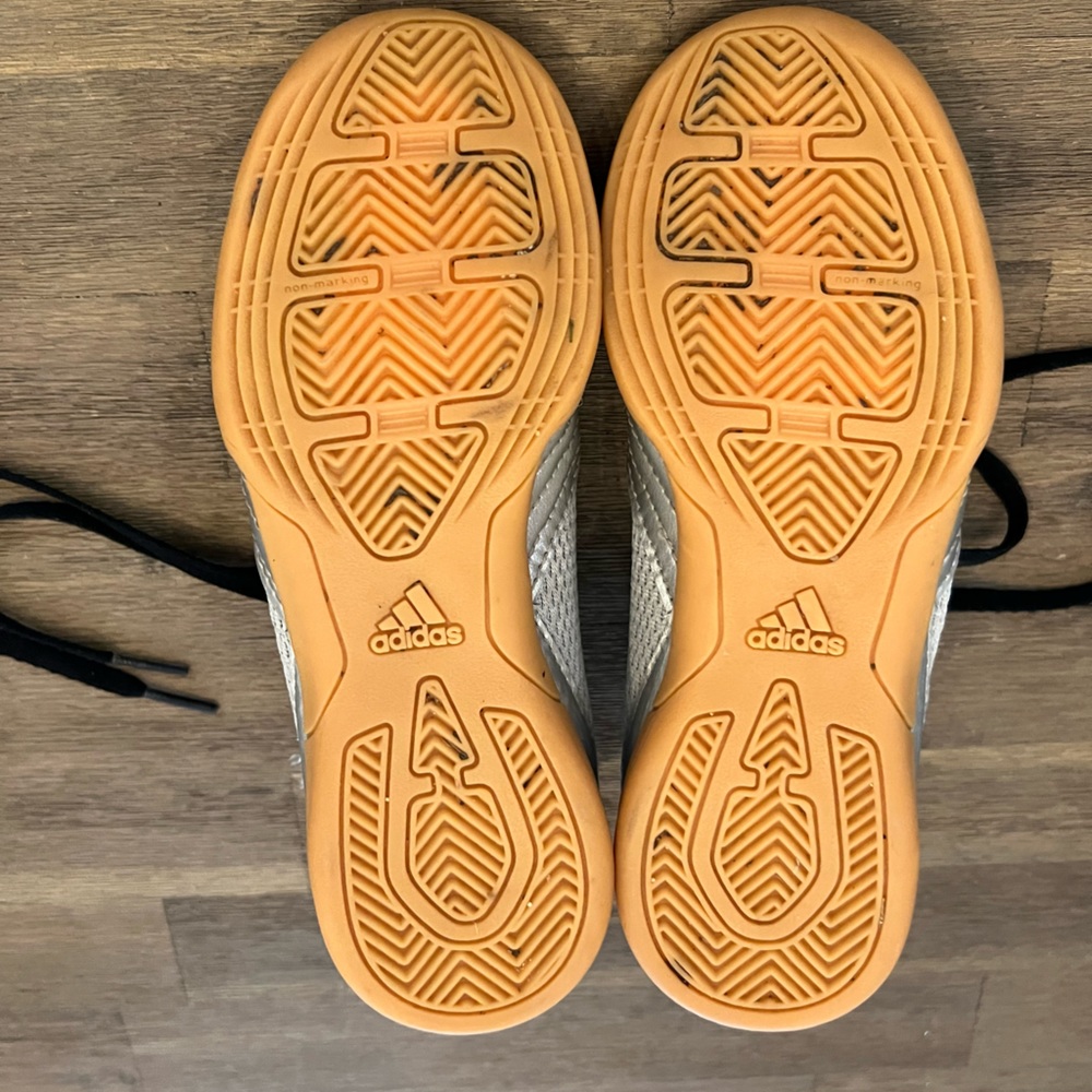 Kids Adidas indoor soccer shoes.